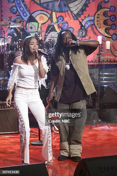 Episode 2285 -- Pictured: Singer Claudette Ortiz and rapper Wyclef Jean perform on June 17, 2002 --