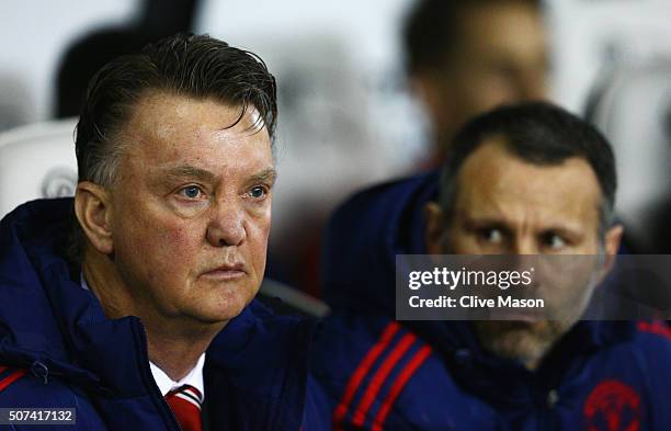 Louis van Gaal manager of Manchester United and assistant coach Ryan Giggs look on prior to during the Emirates FA Cup fourth round match between...