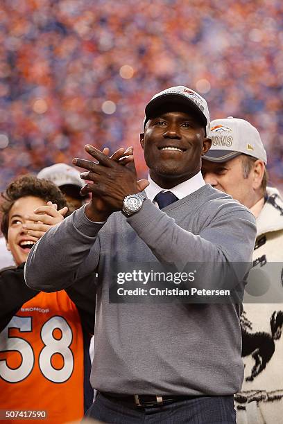 Former Denver Bronco Terrell Davis celebrates after defeating the New England Patriots in the AFC Championship game at Sports Authority Field at Mile...