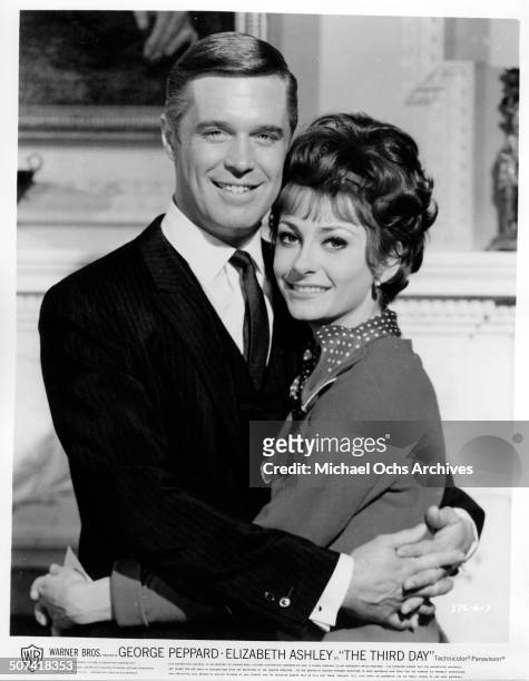 George Peppard as Steve Mallory and Elizabeth Ashley as Alexandria Mallory pose for the Warner Bros. Movie "The Third Day", circa 1965.