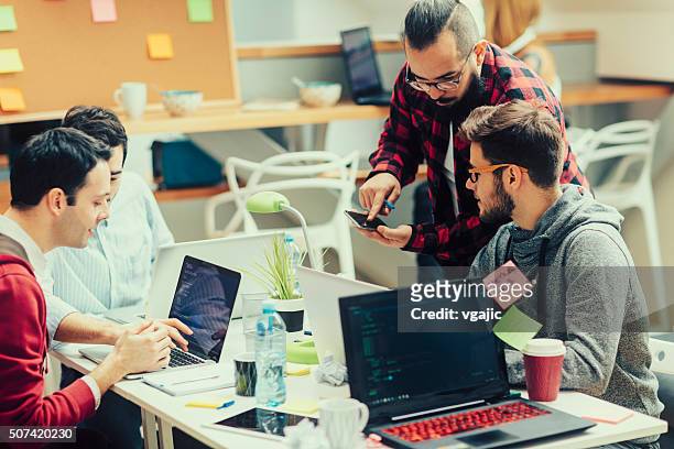 startup programming team. - team effort stock pictures, royalty-free photos & images