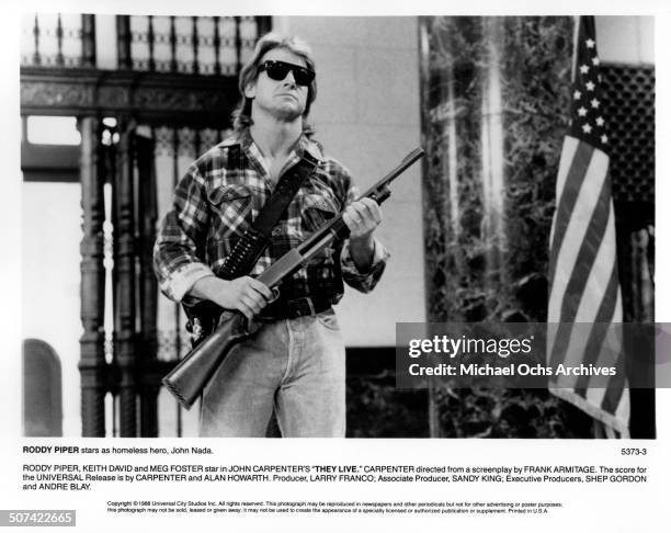 Roddy Piper as Nada carries a rifle in a scene from the Universal Studio movie "They Live", circa 1988.