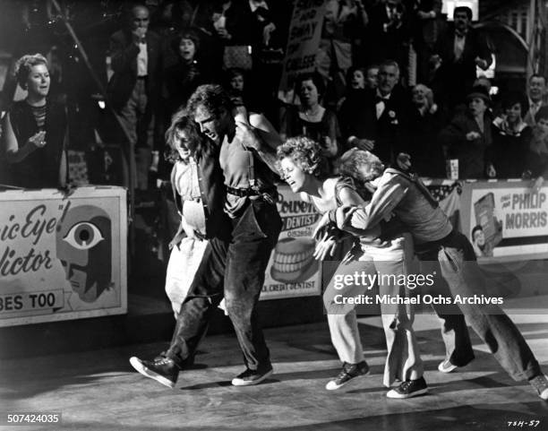 Bonnie Bedelia, Bruce Dern, Jane Fonda and Red Buttons walk off the dance floor in a scene from the movie "They Shoot Horses, Don't They?" , circa...