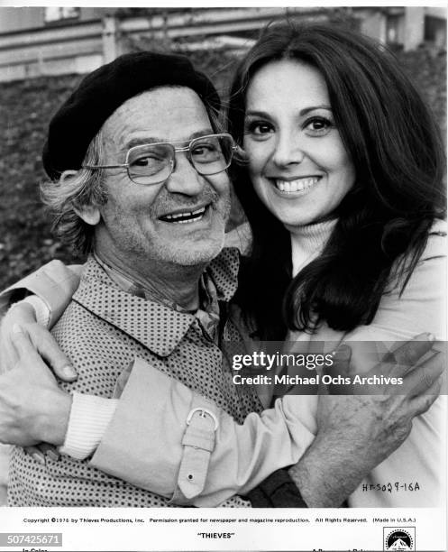 Irwin Corey as Joe Kaminsky and Marlo Thomas as Sally Cramer hug as they pose for the Paramount Pictures movie"Thieves", circa 1977.