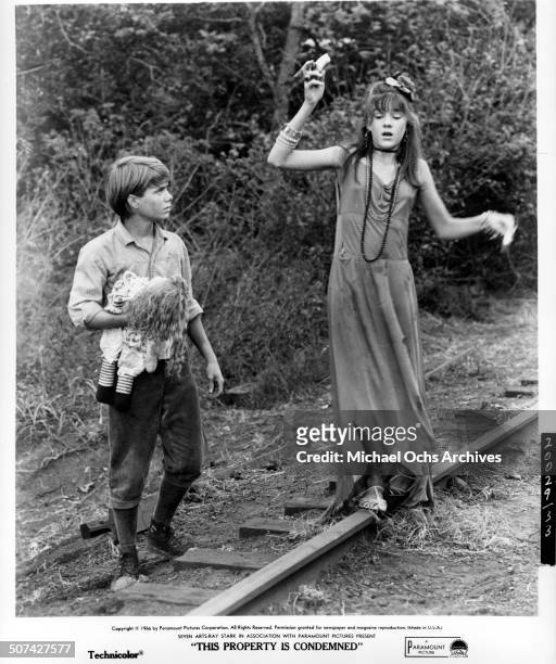 Mary Badham and Jon Provost walks on train track in a scene from the Paramount Pictures movie "This Property Is Condemned" , circa 1966.