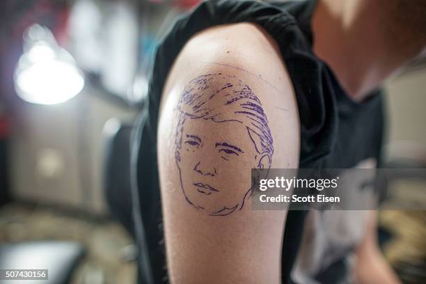 Stencil of Republican presidential candidate Donald Trump on the arm of Seth Bailey at the Clay Dragon Tattoo shop on January 29, 2016 in Seabrook,...