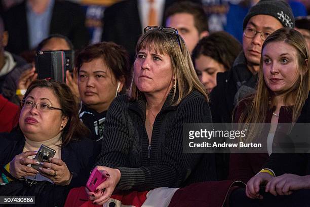 Audience members listen to New York Governor Andrew Cuomo speak at a rally for paid family leave on January 29, 2016 in New York City. The rally was...
