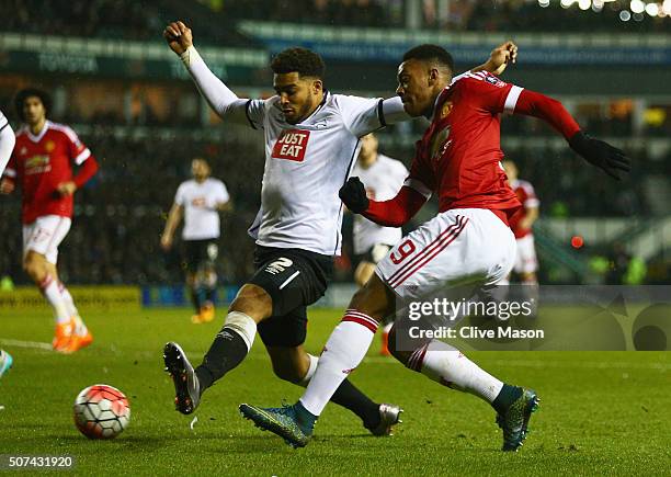 Anthony Martial of Manchester United beats Cyrus Christie of Derby County during the Emirates FA Cup fourth round match between Derby County and...