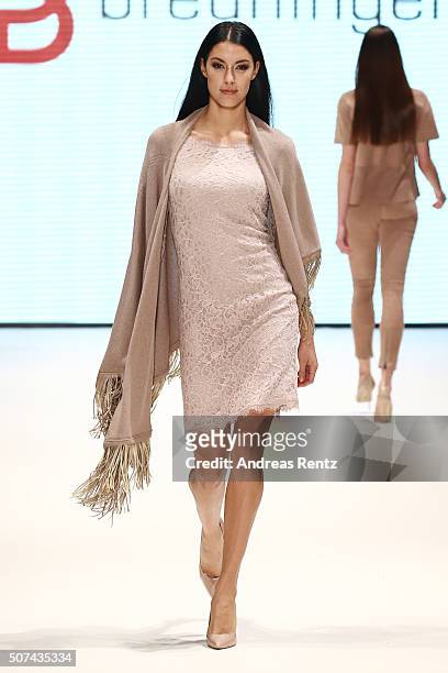 Model Rebecca Mir walks the runway at the Breuninger show during Platform Fashion January 2016 at Areal Boehler on January 29, 2016 in Duesseldorf,...