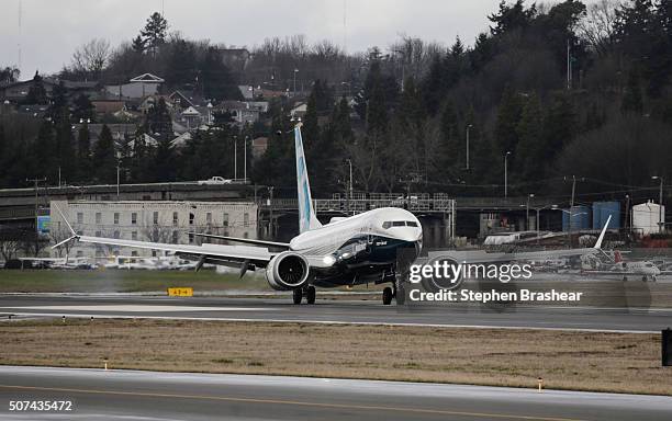 Boeing 737 MAX 8 airliner lands at Boeing Field to complete its first flight on January 29, 2016 in Seattle, Washington. The 737 MAX is the newest...