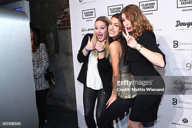 Maren Klever, Rebecca Mir and Amelie Klever perform infront of the Your Photobooth at the Breuninger after show party during Platform Fashion January...