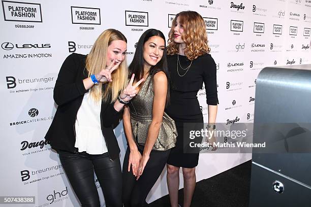 Maren Klever, Rebecca Mir and Amelie Klever perform infront of the Your Photobooth at the Breuninger after show party during Platform Fashion January...