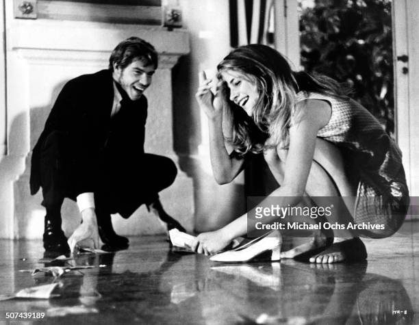 Robie Porter , Charlotte Rampling gather the money she won at the casino in a scene from the movie "Three" , circa 1967.