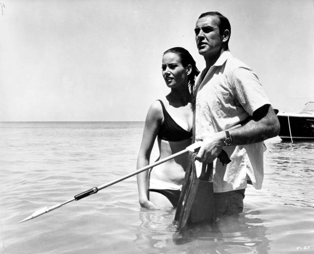 Sean Connery as James Bond protects Claudine Auger as Domino in a scene from the movie "Thunderball", circa 1965.
