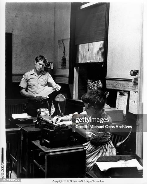 Christopher Connelly chats with Ann Rutherford in a scene from the MGM movie "They Only Kill Their Masters", circa 1972.