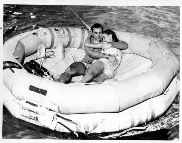 Sean Connery as James Bond protects Claudine Auger as Domino in a scene from the movie "Thunderball", circa 1965.