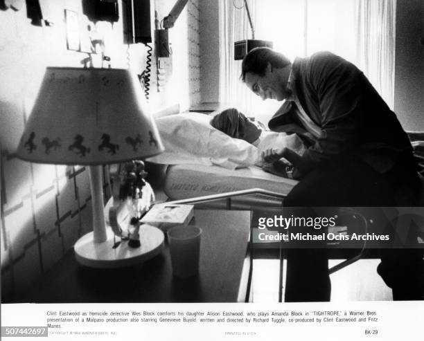 Clint Eastwood a homicide detective Wes Block comforts his daughter Alison Eastwood as Amanda Block in the hospital in a scene from the Warner Bros....