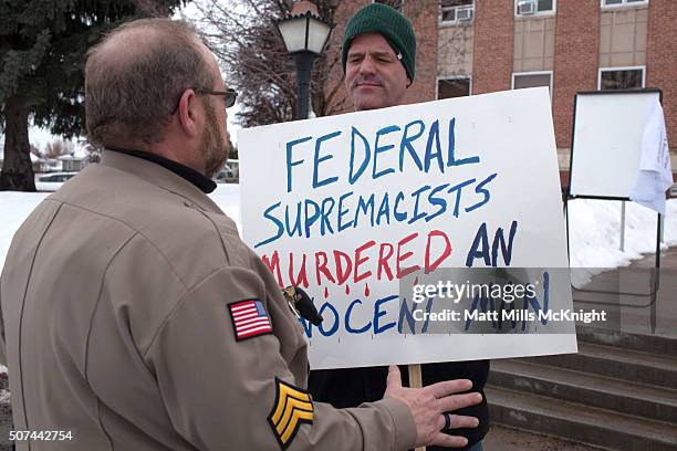 Protester gathered to voice his opposition against law enforcement actions related to the Malheur Wildlife Refuge occupation is told to keep an open...