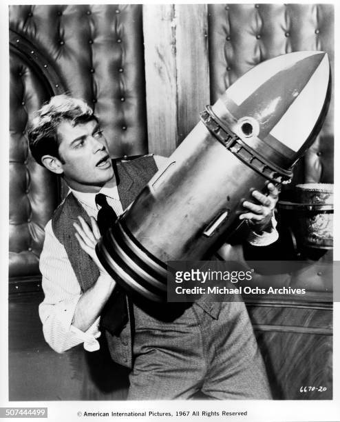 Troy Donahue holds the rocket prototype in a scene from the movie "Those Fantastic Flying Fools", circa 1967.