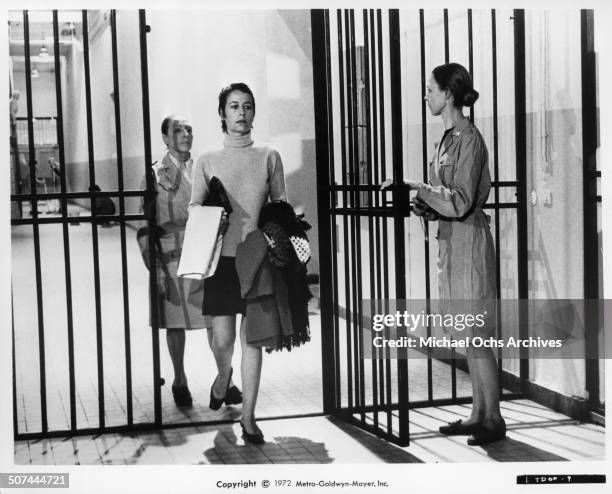 Annie Girardot is lead into prison after being condemned by public and courts for her liaison with a student in a scene from the MGM movie "To Die of...