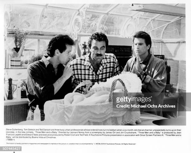 Steve Guttenberg, Tom Selleck and Ted Danson keep quiet as the baby sleeps in a scene from the movie "3 Men and a Baby" , circa 1987.