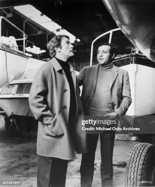 Michel Duchaussoy and Jean Yanne talk about boats in a scene from the movie "This Man Must Die" , circa 1969.