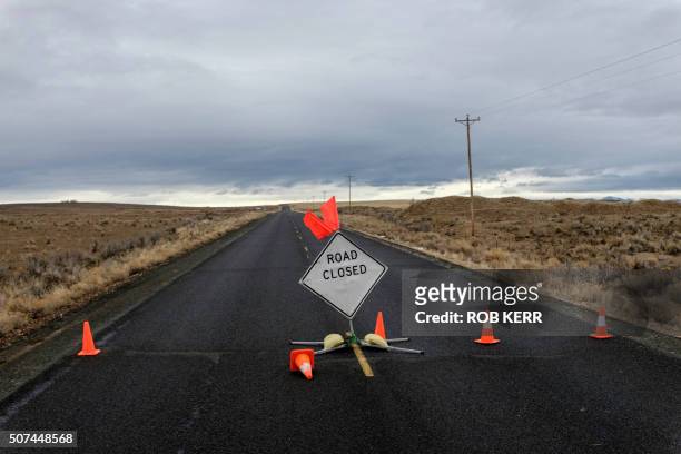 Sign is placed on a closed road to the occupied federal wildlife refuge near Burns, Oregon on January 29 a day after the FBI released video showing...