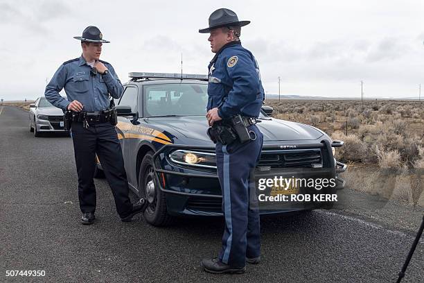 Oregon State Police monitor a checkpoint near the Malheur Wildlife Refuge near Burns, Oregon on January 29, 2016. Eleven people including Bundy have...