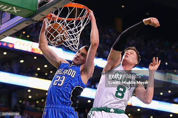 Jonas Jerebko of the Boston Celtics defends a shot by Mario Hezonja of the Orlando Magic during the second quarter at TD Garden on January 29, 2016...