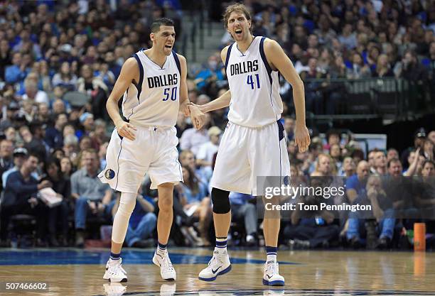 Salah Mejri of the Dallas Mavericks celebrates with Dirk Nowitzki of the Dallas Mavericks after scoring against the Brooklyn Nets in the second half...