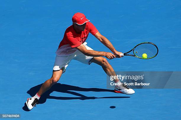 Oliver Anderson of Australia plays a backhand in his Junior Boys' Singles Final match against Jurabeck Karimov of Uzbekistan during the Australian...