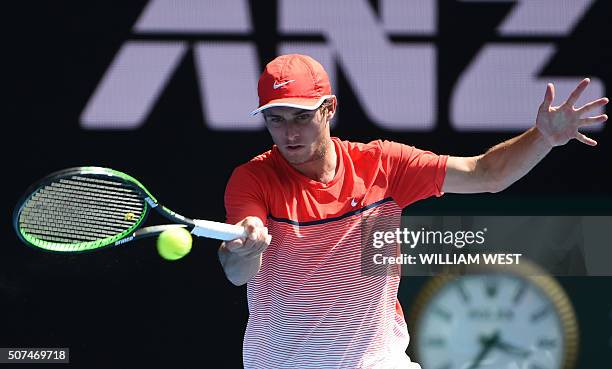 Australia's Oliver Anderson plays a forehand return during his boys singles final match against Uzbekistan's Jurabeck Karimov on day thirteen of the...