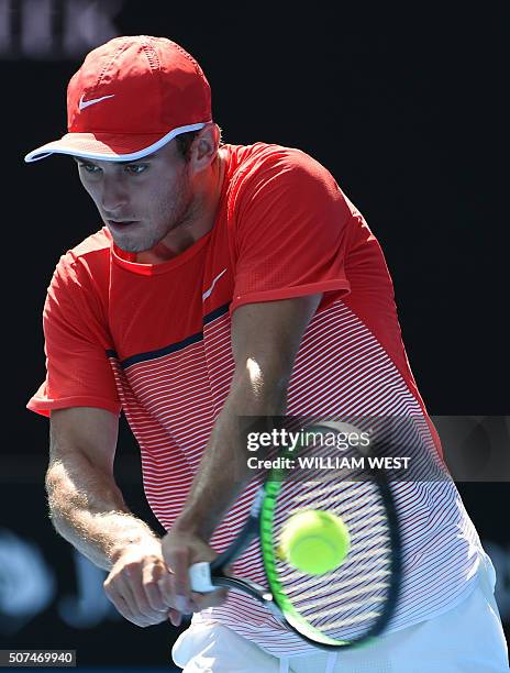 Australia's Oliver Anderson plays a backhand return during his boys singles final match against Uzbekistan's Jurabeck Karimov on day thirteen of the...