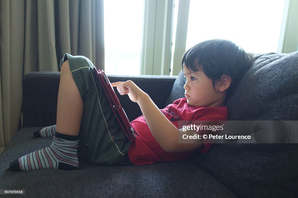 Boy using tablet PC