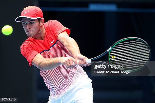 Oliver Anderson of Australia plays a backhand in his Junior Boys' Singles Final match against Jurabeck Karimov of Uzbekistan during the Australian...