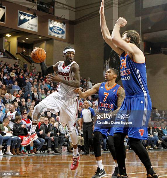 Briante Weber from the Sioux Falls Skyforce looks for a teammate past the defense of Devondrick Walker and Jordan Bachynski from the Westchester...