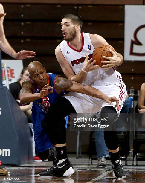 Byron Mullens from the Sioux Falls Skyforce controls the ball as Keith Bogans from the Westchester Knicks reaches in at the Sanford Pentagon on...