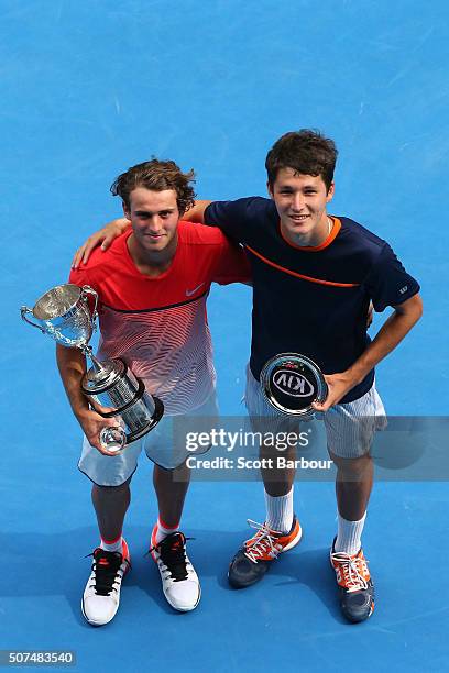 Oliver Anderson of Australia and Jurabeck Karimov of Uzbekistan pose with their trophies after the Junior Boys' Singles Final match during the...