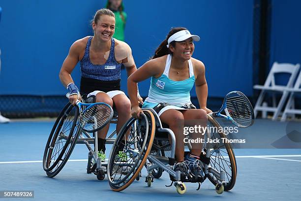 Marjolein Buis of the Netherlands and Yui Kamiji of Japan celebrate winning the Women's Wheelchair Doubles Final match against Jiske Griffioen of...