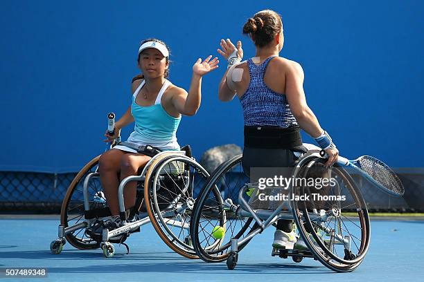 Marjolein Buis of the Netherlands and Yui Kamiji of Japan compete in the Women's Wheelchair Doubles Final match against Jiske Griffioen of...