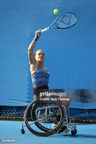 Marjolein Buis of the Netherlands plays a forehand in her match with Yui Kamiji of Japan against Jiske Griffioen of Netherlands and Aniek Van Koot of...