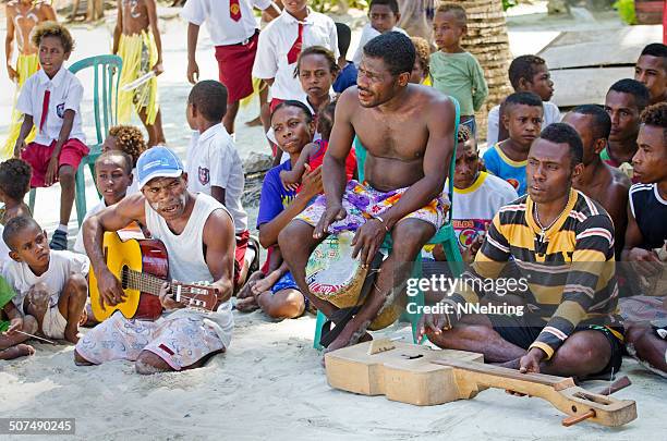 local musicians and children - west papua stock pictures, royalty-free photos & images