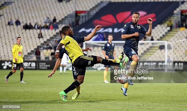 Rolieny Bonevacia of the Wellington Phoenix is challenged by Storm Roux and Joshua Rose of the Central Coast Mariners during the round 17 A-League...