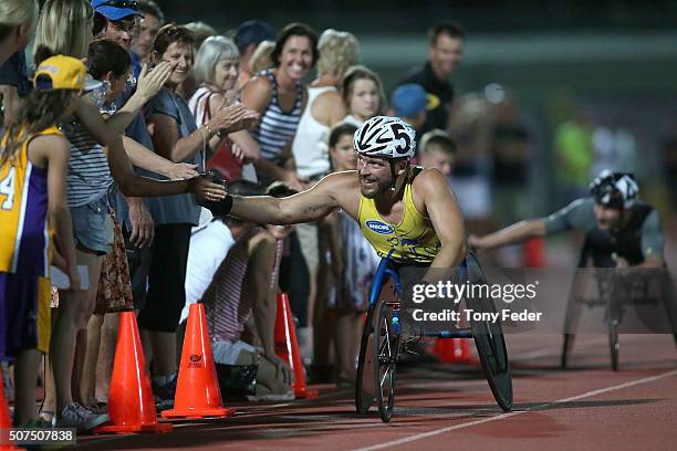 Kurt Fearnley greets the crowd after winning the Mens 1500m wheelchair during the 2016 Hunter Track Classic on January 30, 2016 in Newcastle,...