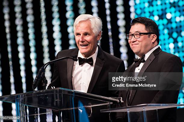 Producer/ writer Chris Carter and editor Robert Komatsu present an award at the 66th Annual ACE Eddie Awards at The Beverly Hilton Hotel on January...