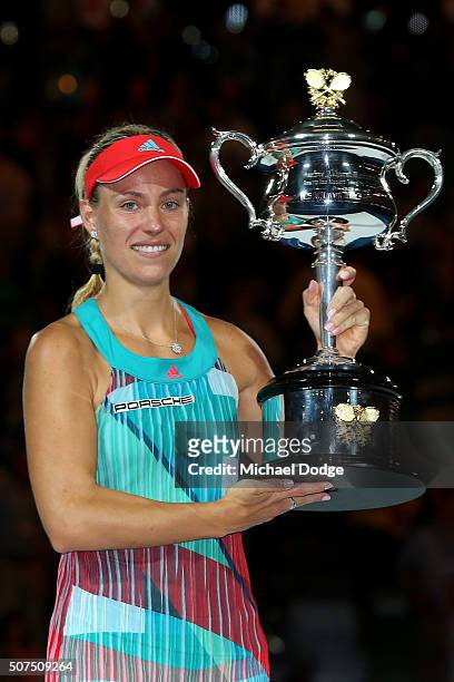 Angelique Kerber of Germany poses with the Daphne Akhurst Trophy after winning the Women's Singles Final against Serena Williams of the United States...