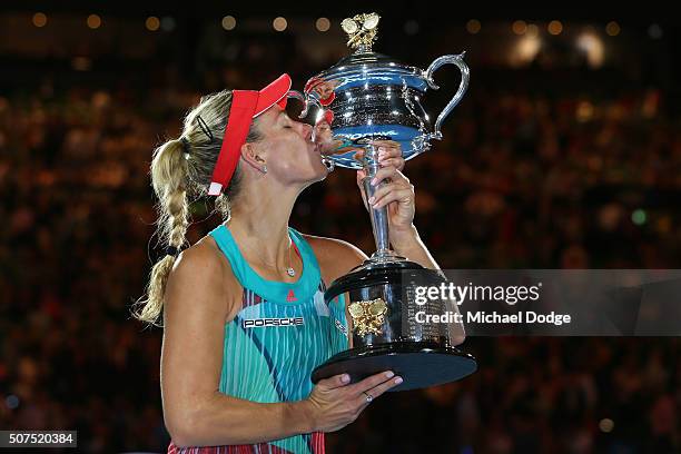 Angelique Kerber of Germany kisses the Daphne Akhurst Trophy after winning the Women's Singles Final against Serena Williams of the United States...