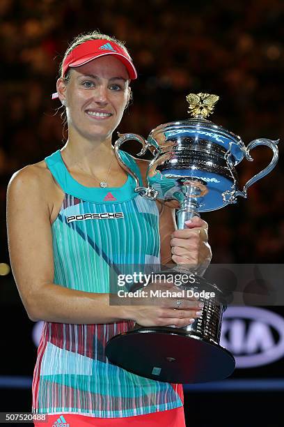 Angelique Kerber of Germany poses with the Daphne Akhurst Trophy after winning the Women's Singles Final against Serena Williams of the United States...