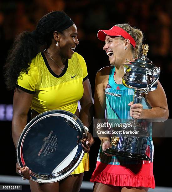 Australian Open runner-up Serena Williams of the United States and winner Angelique Kerber of Germany pose with their trophies after Women's Singles...