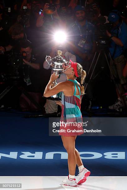Angelique Kerber of Germany kisses the Daphne Akhurst Trophy after winning the Women's Singles Final against Serena Williams of the United States...